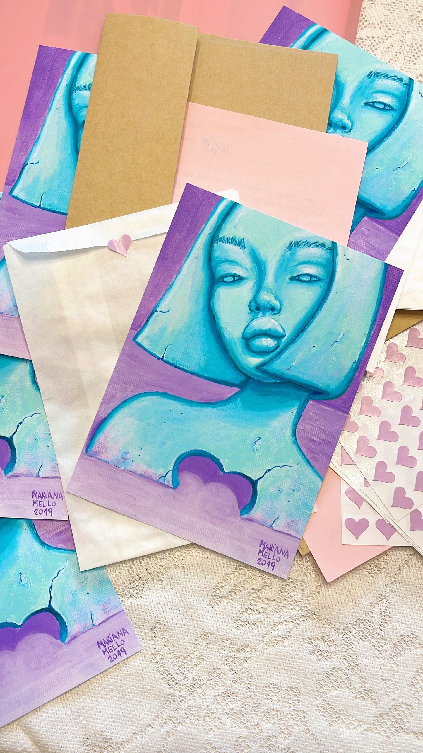 Collection of greeting cards with artistic designs on a textured surface