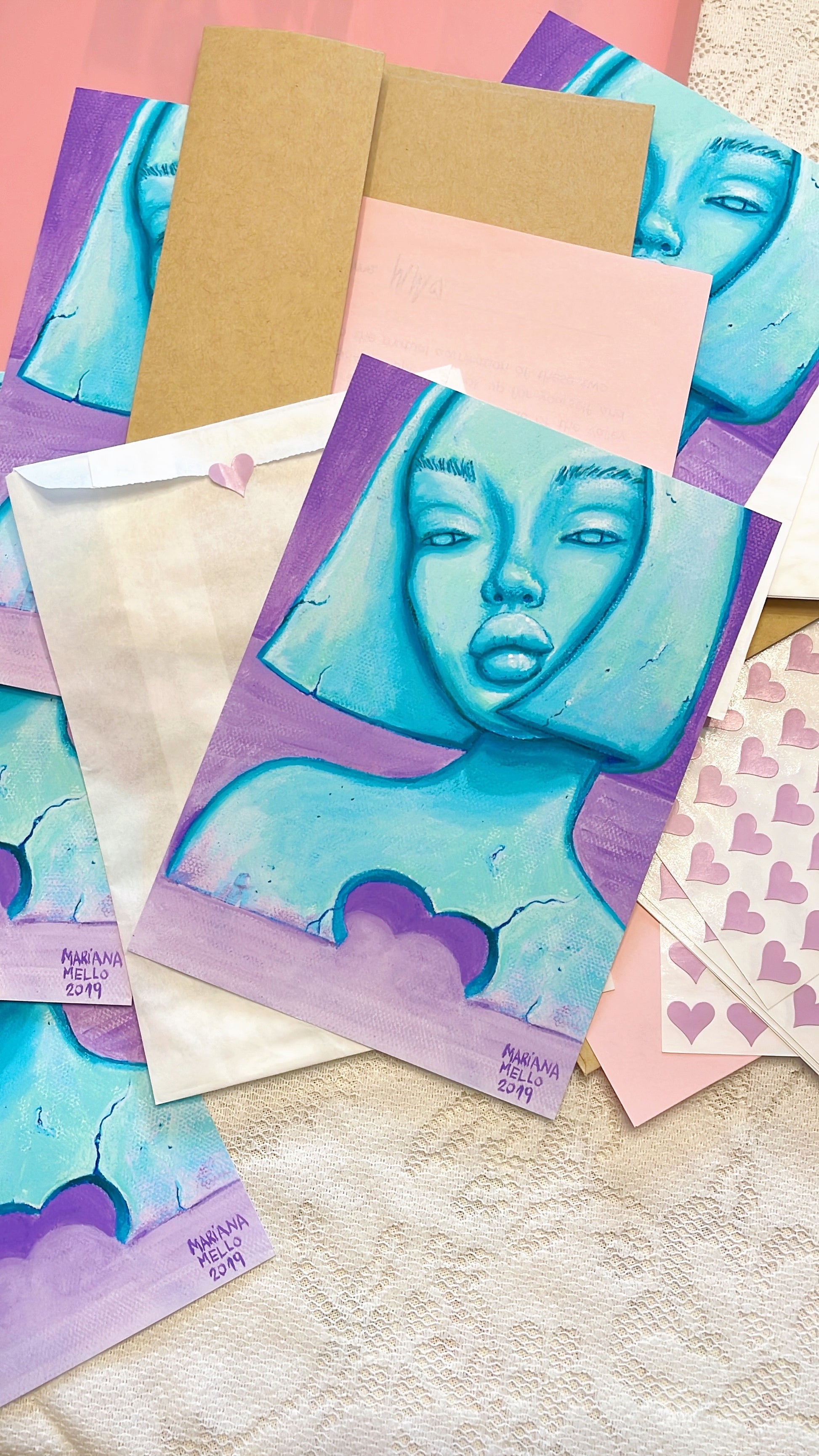 Collection of greeting cards with artistic designs on a textured surface